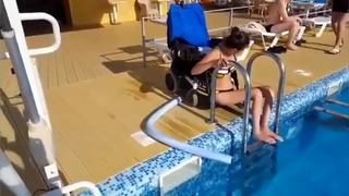 Paraplegic Crawling Out Of The Pool
