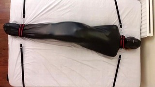 Sub in Bondage Bag Tied Down to the Bed Breathplay