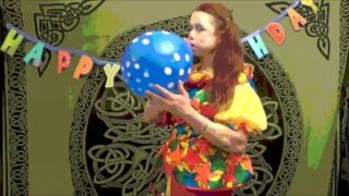 Creepy Clown Inflating And Playing With Balloons